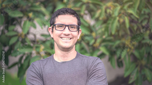 Portrait of latin young man smiling outdoors