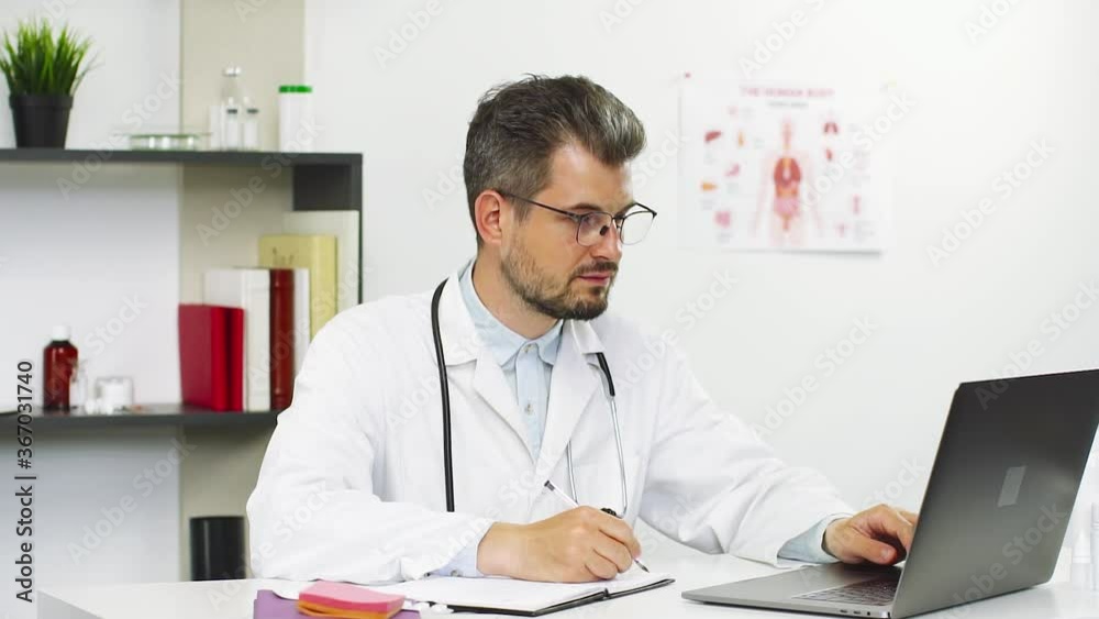 modern doctor working with medical files and computer modern doctor working with medical files and computer