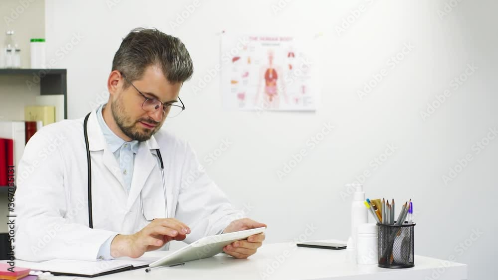 doctor working on tablet at hospital doctor working on tablet at hospital