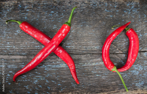 red chili pepper isolated on a wooden background. Spice - Bright colors of fresh chilies.