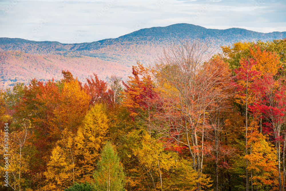 Autumn in the mountains. Vibrant Fall colors in display near Stowe, Vermont 