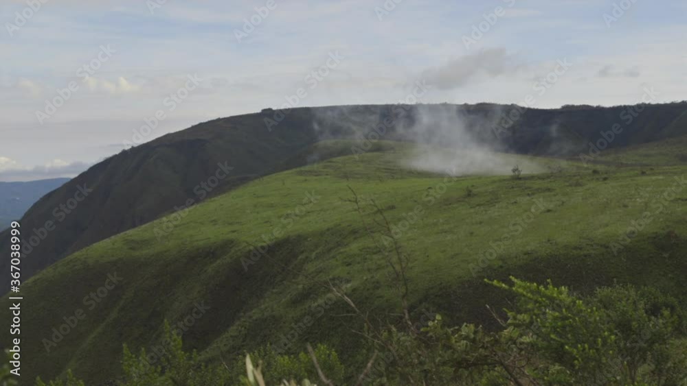 Time lapse of cloud forming on top of a hill Time lapse of cloud forming on top of a hill