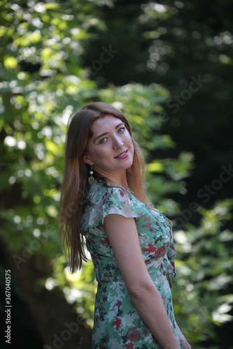 woman in green dress on nature 