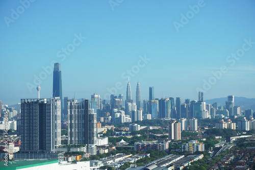 Beautiful city skyline of Kuala Lumpur during hot afternoon time. Kuala Lumpur is the capital of Malaysia. © peacefoo