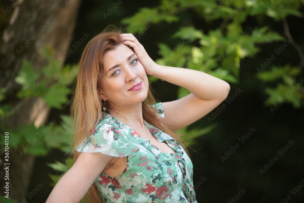 woman in green dress on nature  