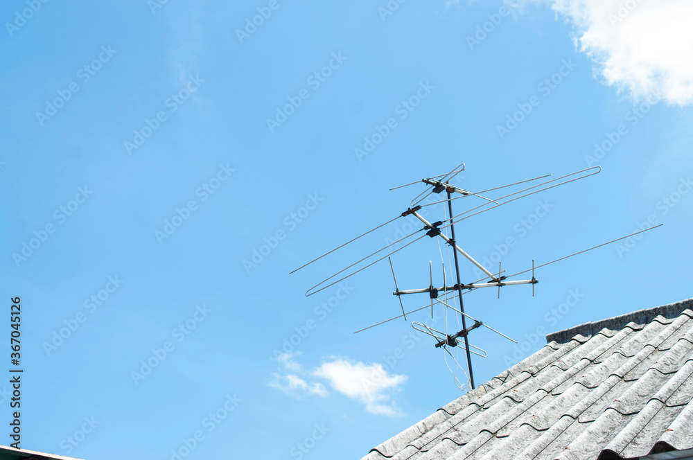 Television antenna on sky background