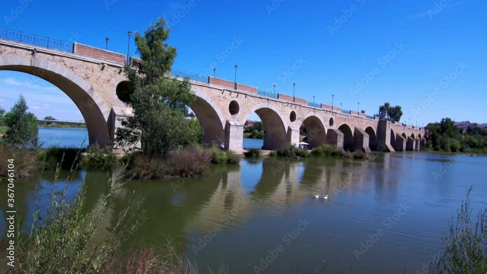 Aerial view of roman bridge in a river of city. Drone Footage Aerial view of roman bridge in a river of city. Drone Footage