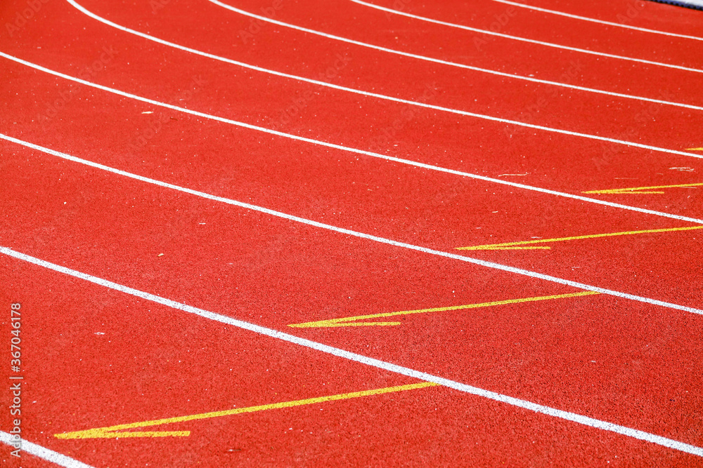 Athletic running track for running race. Sport and excercise concept. Athletic running track for running race. Sport and excercise concept.