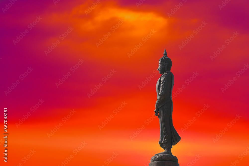 Sunday Buddha and sunset red orange cloud on sky on the Asanha bucha day