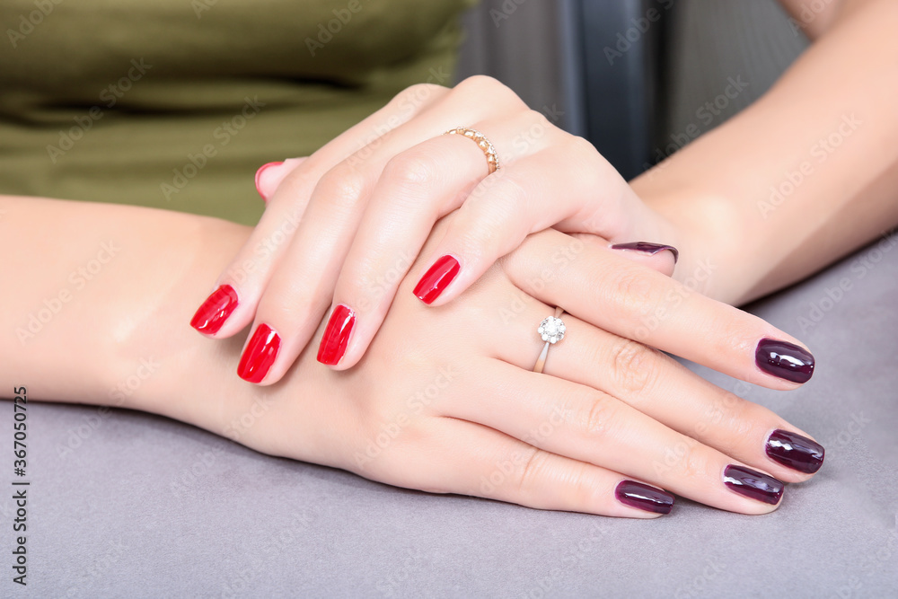 Fototapeta premium The girl's long fingers were painted with nail polish