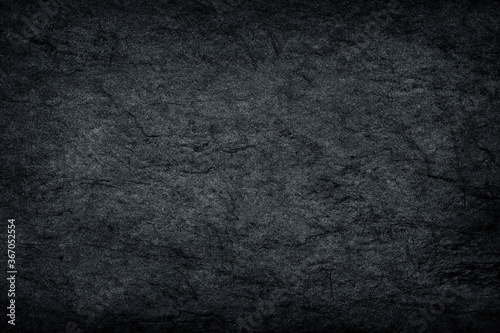 Dark grey stone / black slate stone background or texture