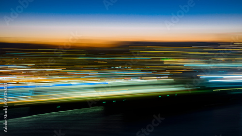 Motion blur: sunset in a river city