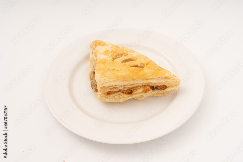 Puff pastry triangles on white background. Puff pastry triangles on white background.