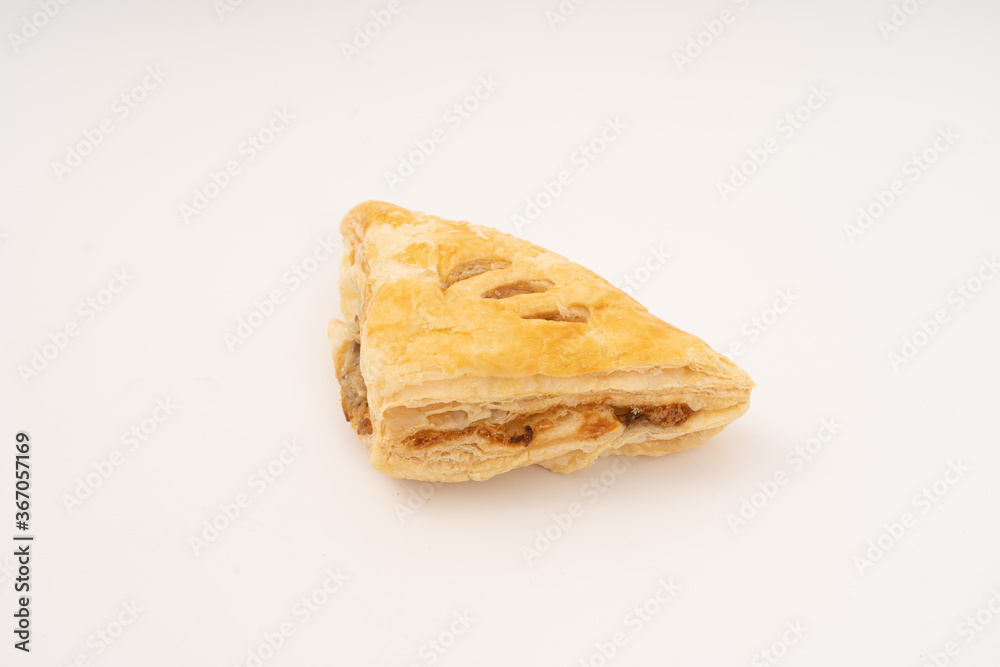 Puff pastry triangles on white background. Puff pastry triangles on white background.