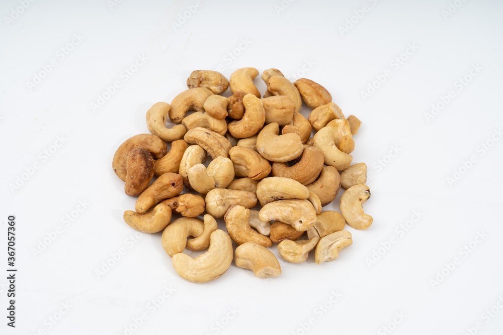 Tasty cashew nuts on white background. Tasty cashew nuts on white background.