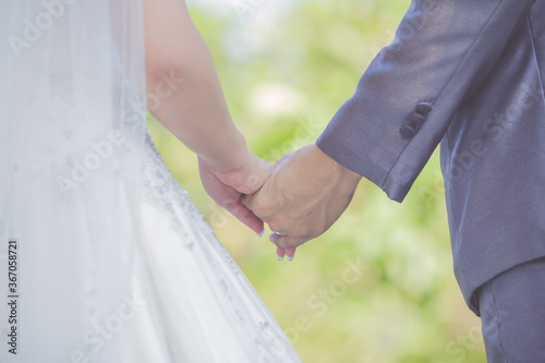 wedding theme, holding hands newlyweds © kaewphoto