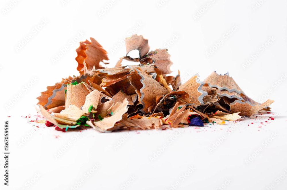 Shavings of red pencil in close-up on a white background. Pencil lead whole and broken on a white background. Leftovers from a pencil. Macro, a pile of shavings Shavings of red pencil in close-up on a white background. Pencil lead whole and broken on a white background. Leftovers from a pencil. Macro, a pile of shavings