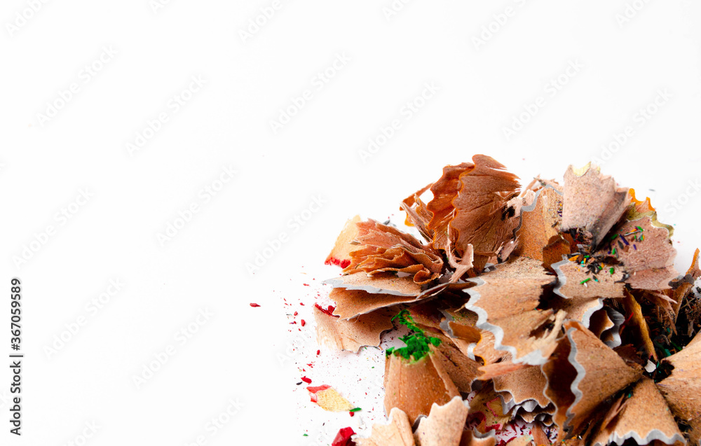 Shavings of red pencil in close-up on a white background. Pencil lead whole and broken on a white background. Leftovers from a pencil. Macro, a pile of shavings Shavings of red pencil in close-up on a white background. Pencil lead whole and broken on a white background. Leftovers from a pencil. Macro, a pile of shavings