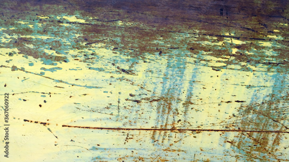 
Rusty and painted metal surface. Defocused and blurred background