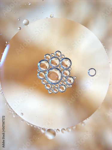 abstract background with yellow gold bubbles oil in water ,macro image ,sweet color for lovely card , shiny droplets for web design