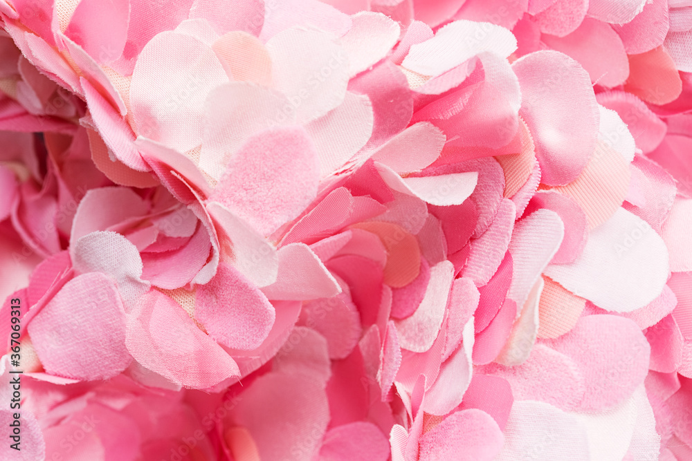 Wavy composition of delicate pink textile petals