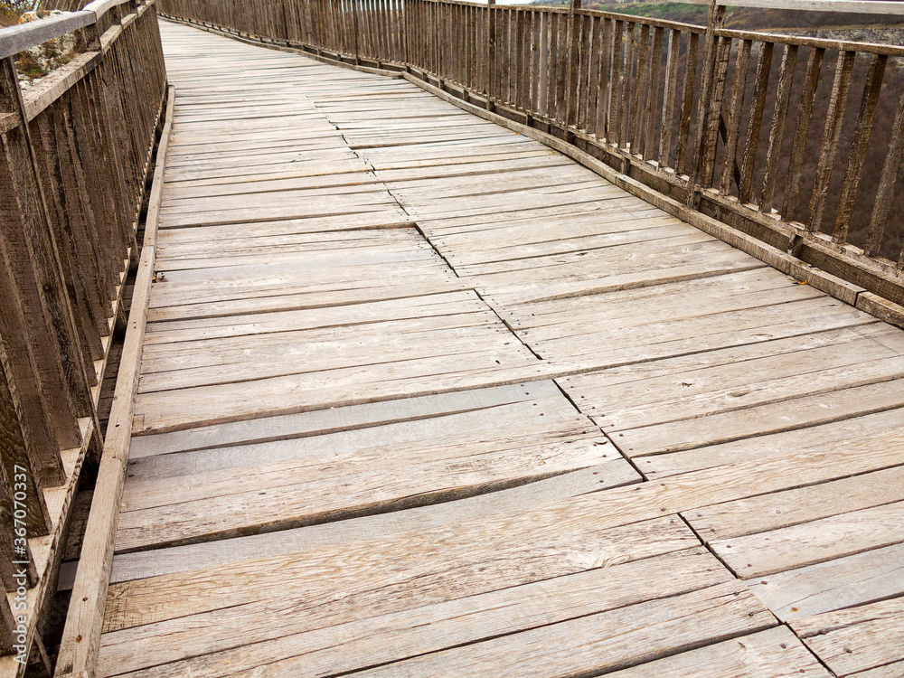 Fototapeta premium Ancient wooden staircase in the medieval fortress 3rd - 7th and 11th - 17th century (East date) Ovech in Provadia, Bulgaria
