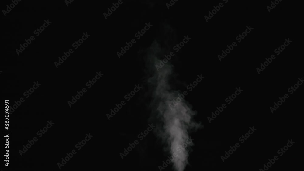 Slow motion thin water mist stream over black background Slow motion thin water mist stream over black background