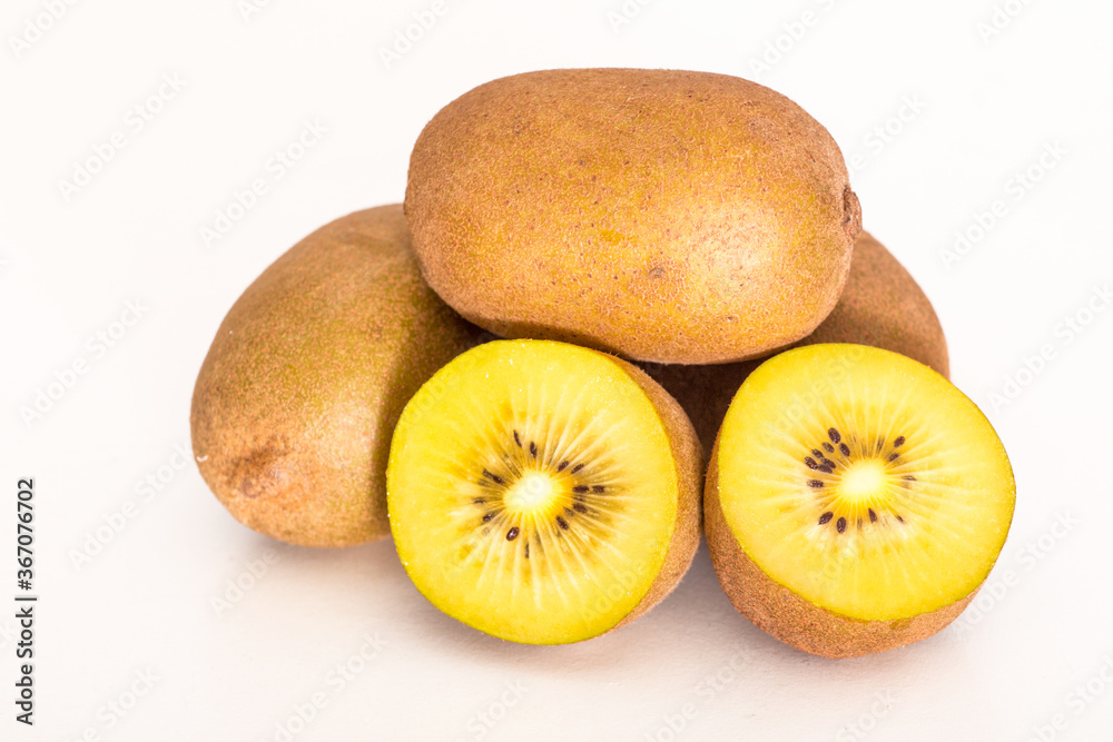 Kiwi with yellow meat on white background Kiwi with yellow meat on white background