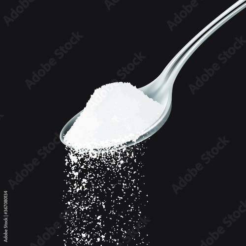 Sea salt in spoon on black background 
