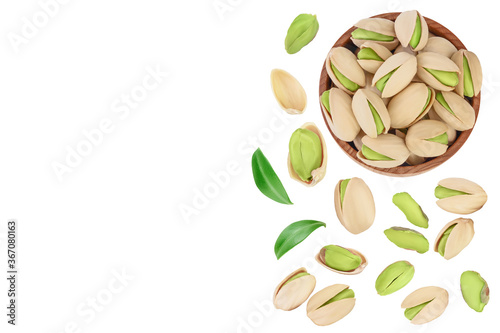 pistachio in wooden bowl isolated on white background . Top view with copy space for your text. Flat lay