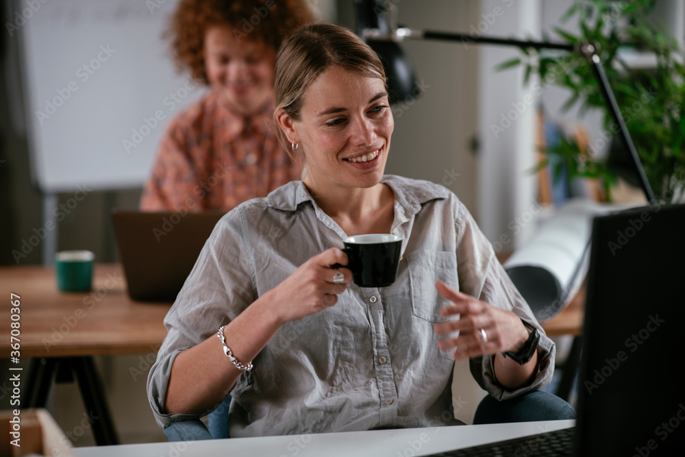Young businesswoman drinking coffee in her office
Young businesswoman drinking coffee in her office