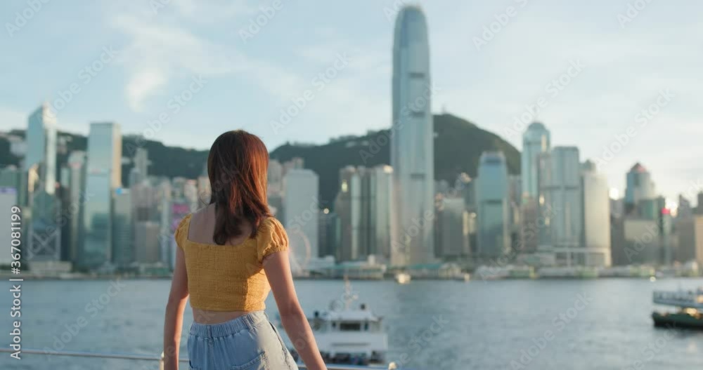 Woman look at the city in Hong Kong Woman look at the city in Hong Kong