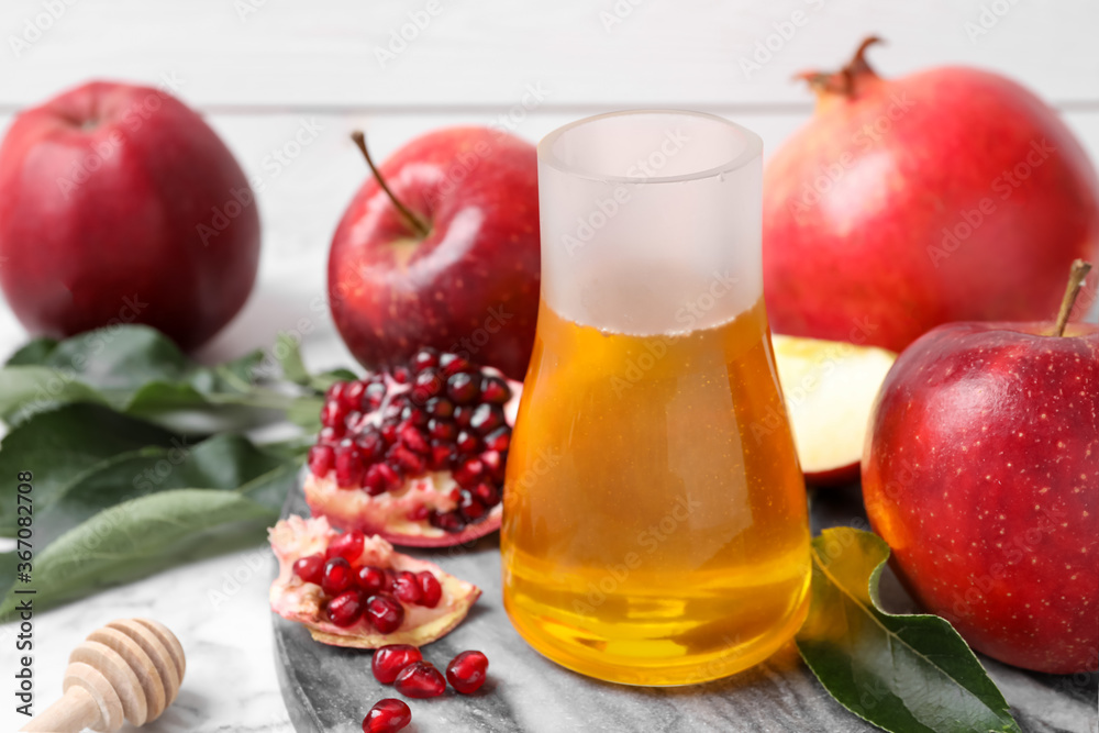 Honey, apples and pomegranate on table. Rosh Hashanah holiday Honey, apples and pomegranate on table. Rosh Hashanah holiday