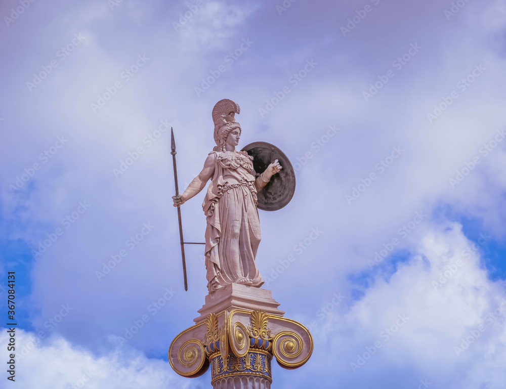 Athena, the ancient Greek goddess of wisdom and knowledge under impressive sky, Athens Greece