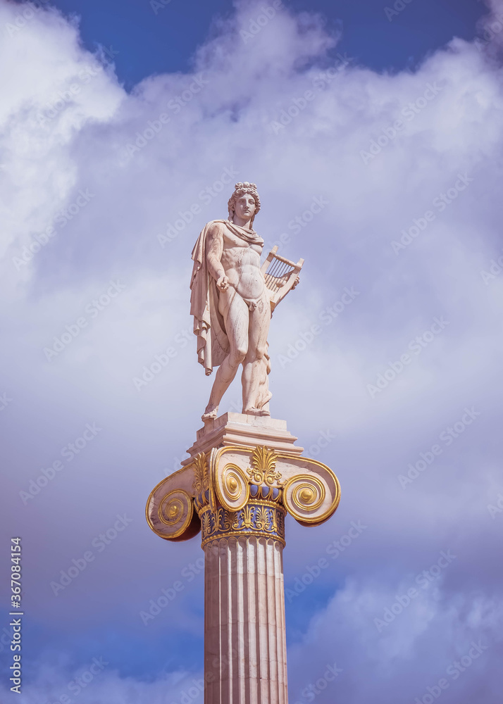 Apollo, the ancient Greek god of arts under impressive sky, Athens ...