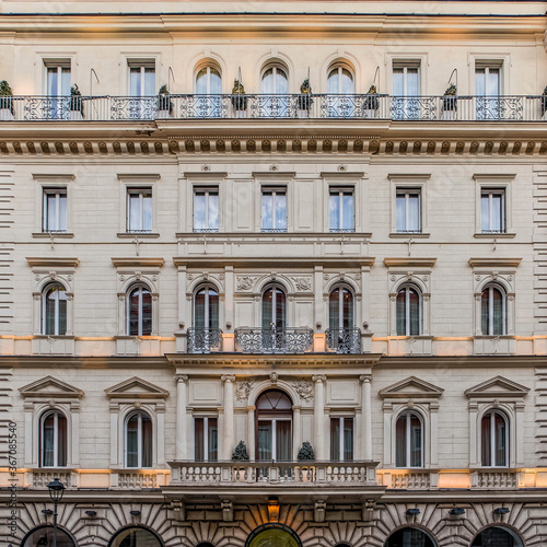illuminated vintage building facade windows pattern, Rome Italy © Dimitrios