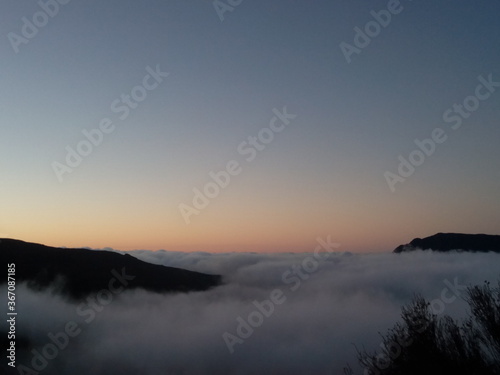 Sunset top mountain peak over cloud flying, liberty trailing © do U see