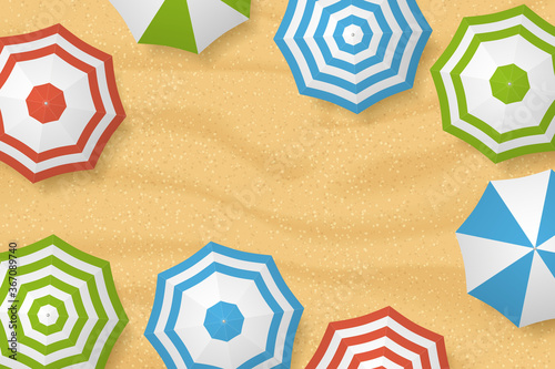 Sandy beach and colorful sun umbrellas. Top view. Summer vacation banner background with place for text. Summer beach. View from above.