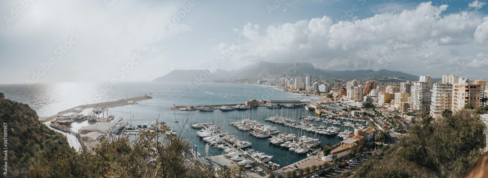 Obraz premium Breathtaking aerial view Calpe, Costa Blanca. Popular summer resort in Spain with mediterranean sea and Las Salinas lake, mountains at the background.