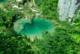 Clean and green Plitvice lake with waterfall in Croatia national park 