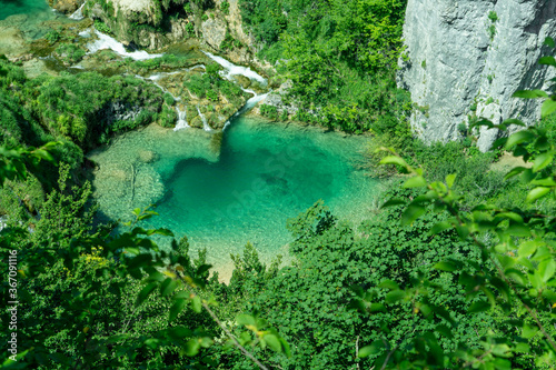 Clean and green Plitvice lake with waterfall in Croatia national park 