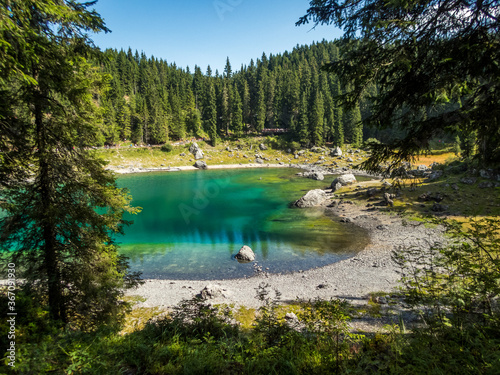 Karersee below the Karerpass at the foot of the Latemar massif photo