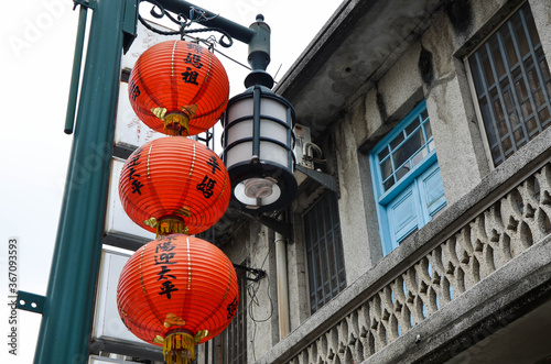 Yunlin, Taiwan - AGU 02, 2019: Red lantern hanging outside the ancient house in Xiluo old street. photo