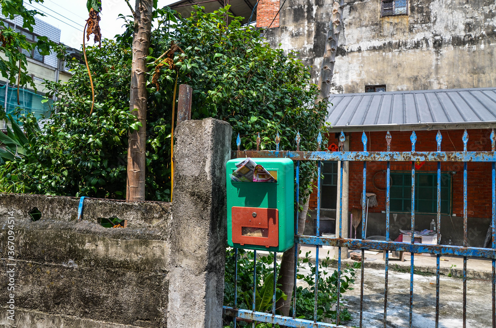 Yunlin, Taiwan - AGU 02, 2019: Green mailbox on the door. Yunlin, Taiwan - AGU 02, 2019: Green mailbox on the door.