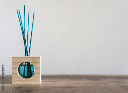 mikado blue wooden air freshener with white background photo