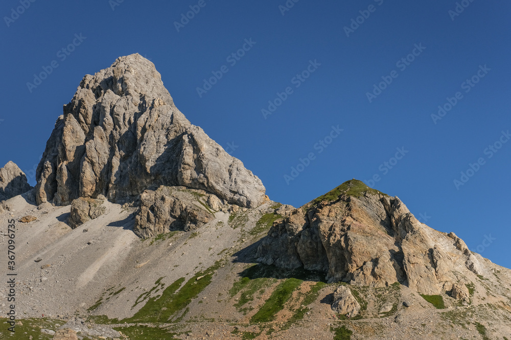 Early [sunny] morning  view of Grosse Kinigat mountain and Hintersattel pass as seen from Filmoor refuge, Carnic Highroute Trek, Carnic Alps, East Tirol, Austria.