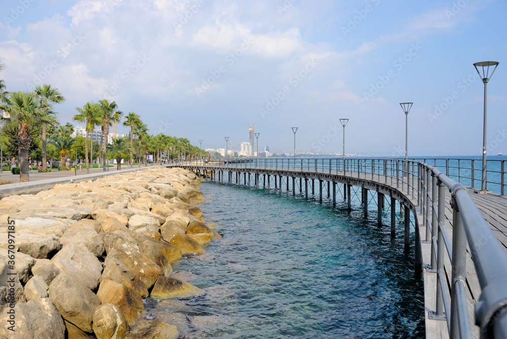 Fototapeta premium View of Limassol promenade with palm trees on a beautiful sunny day in Cyprus