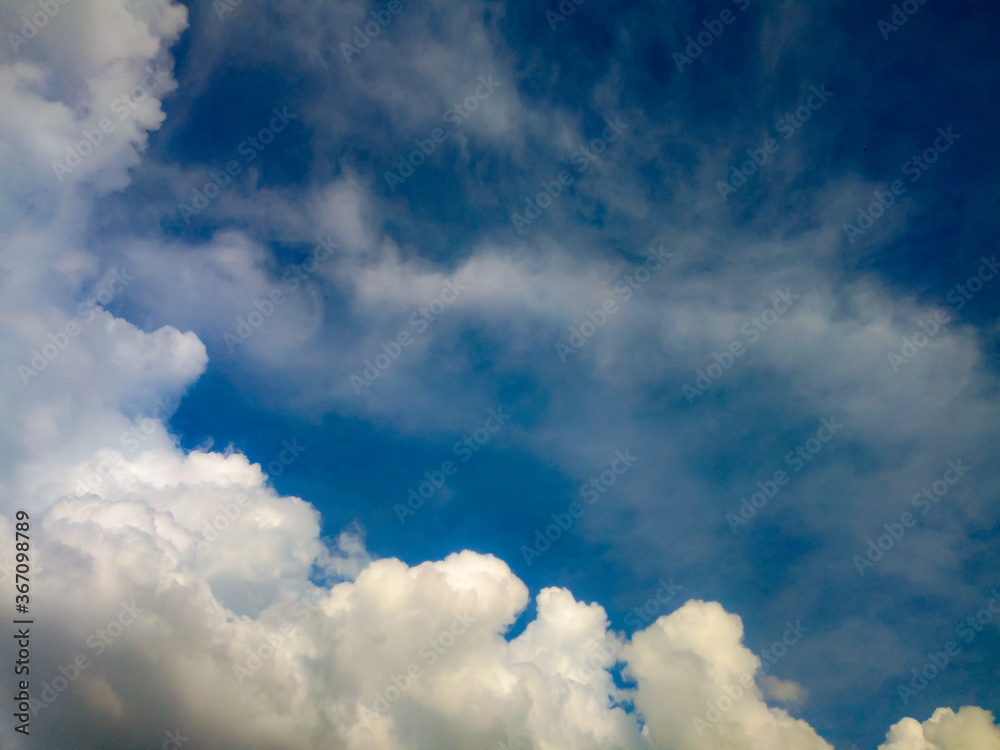 The sky and white clouds in the background The sky and white clouds in the background