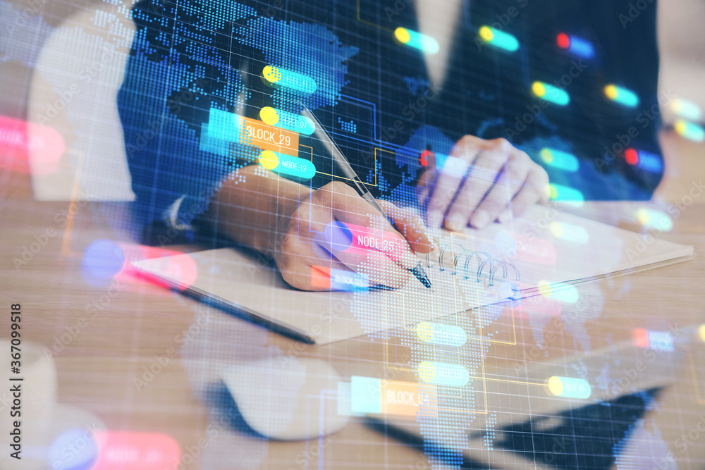 Double exposure of writing hands on background with data solution hologram on front. Technology concept. Close up Double exposure of writing hands on background with data solution hologram on front. Technology concept. Close up