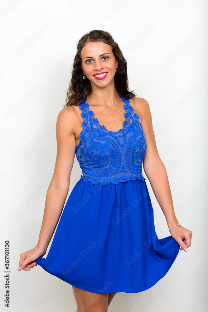 Portrait of young beautiful woman with curly hair